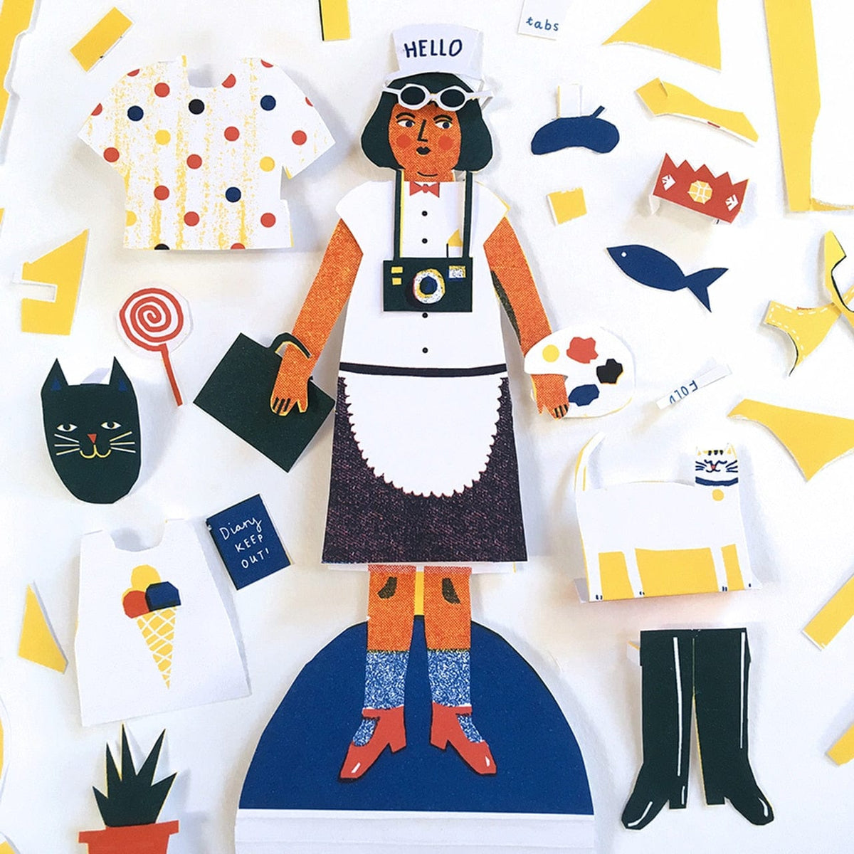 The Printed Peanut Cut Out and Dress Up Paper Doll